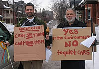 men with signs and leaflets